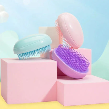Brosse à cheveux mini oeufs 3 coloris