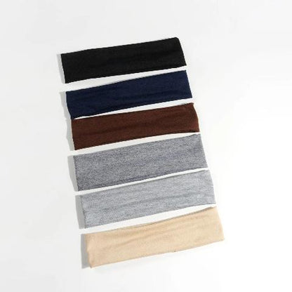 Bandeau cheveux 6 couleurs posés sur un plan blanc
