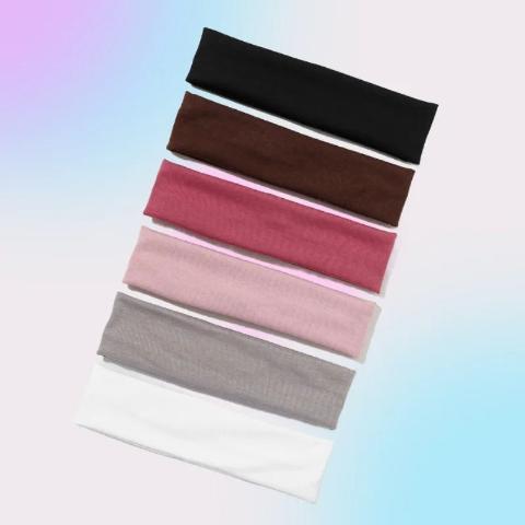 Bandeau cheveux 6 couleurs posés sur un plan blanc