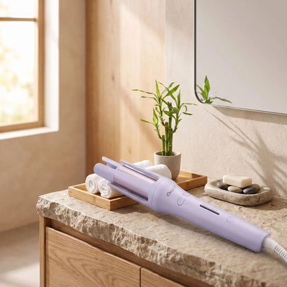 boucleur mauve posé sur un comptoir de  salle de bain en granit 