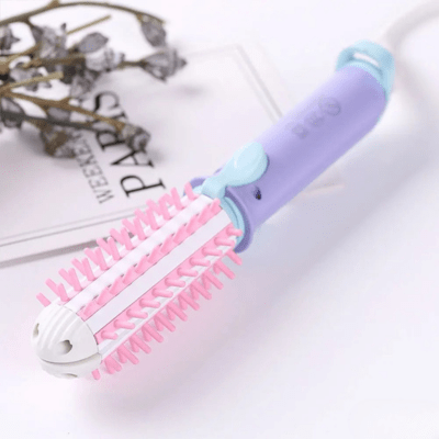 Boucleur mini easy de couleur violet, rose et bleu sur un plan blanc